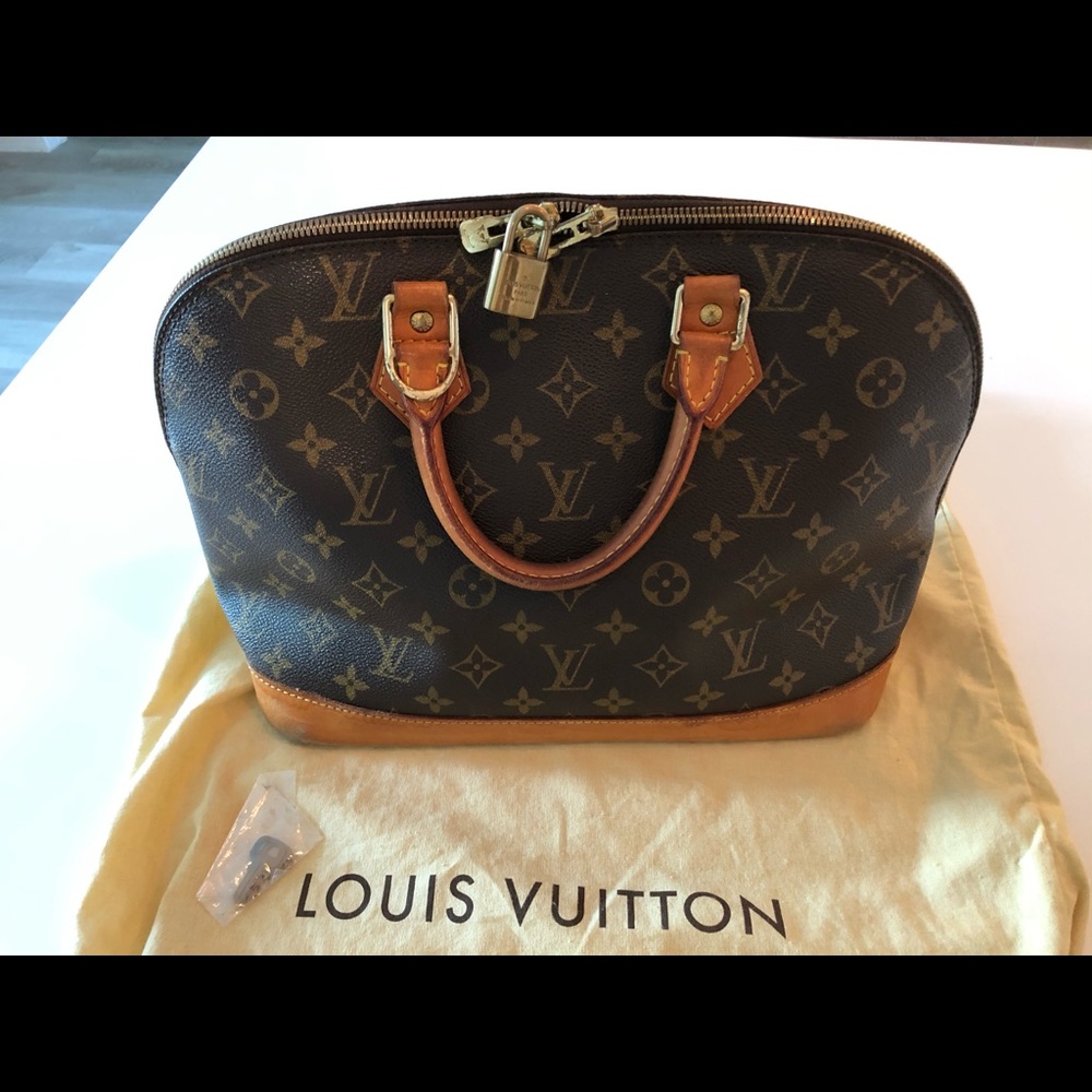 LV Alma bag w/lock & key and dust bag
